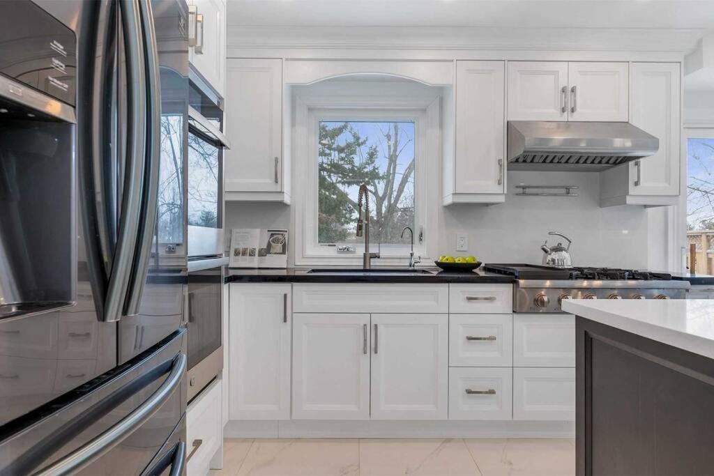 Modern main floor 3-bedroom apartment backing onto a park photo 3