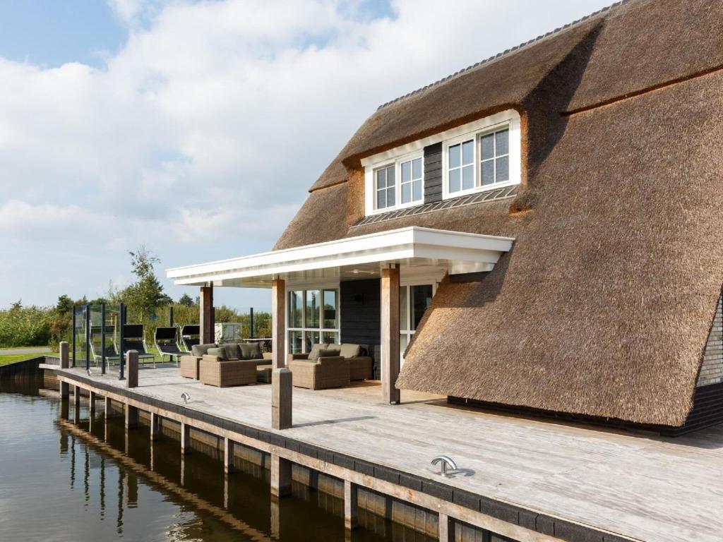 Beautiful villa with sauna and unobstructed view, on a holiday park in Friesland photo 1