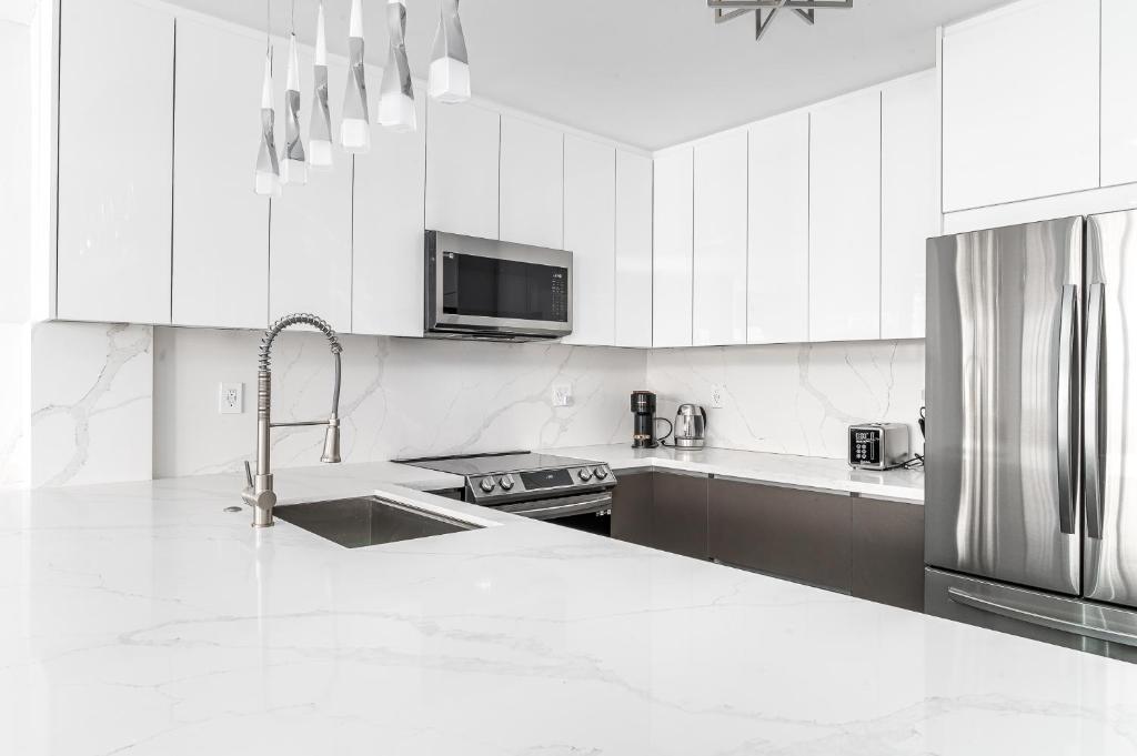 AMAZING 2BR 2BA NEWLY RENO BEACHFRONT APT W/BEACH VIEW - Tap to explore photos