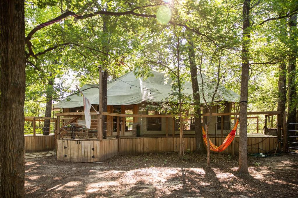 Luxurious African tent wwaterfall on the Brazos River! 350 acres! Tubing! Petting Zoo! image