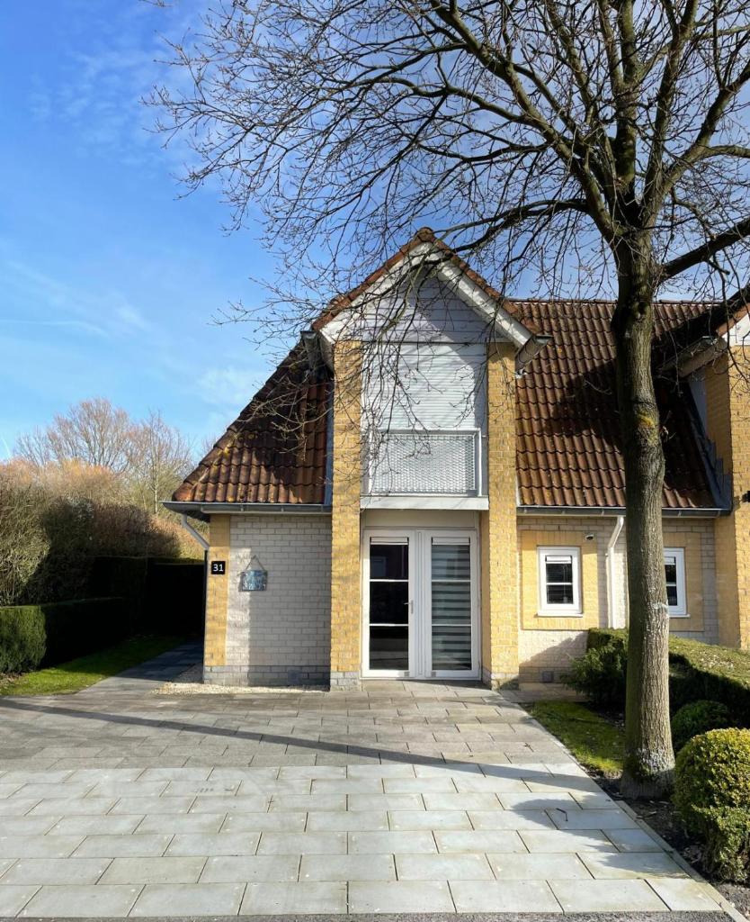 Vakantiehuisje met Luxe Tuin dichtbij het strand photo 1