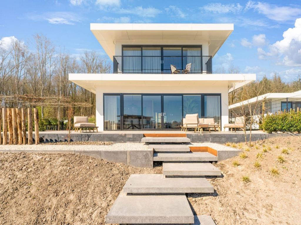 Modern water villa in Zeewolde with jetty