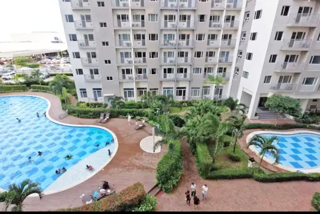 Chic 2BR Condo Unit at South Residences - Tap to explore photos