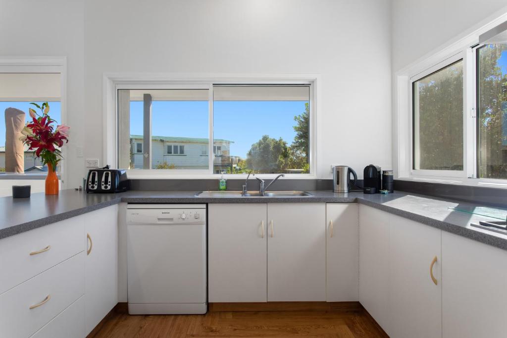 Elevated Beach Oasis - Ohope Beach Holiday Home - Tap to explore photos