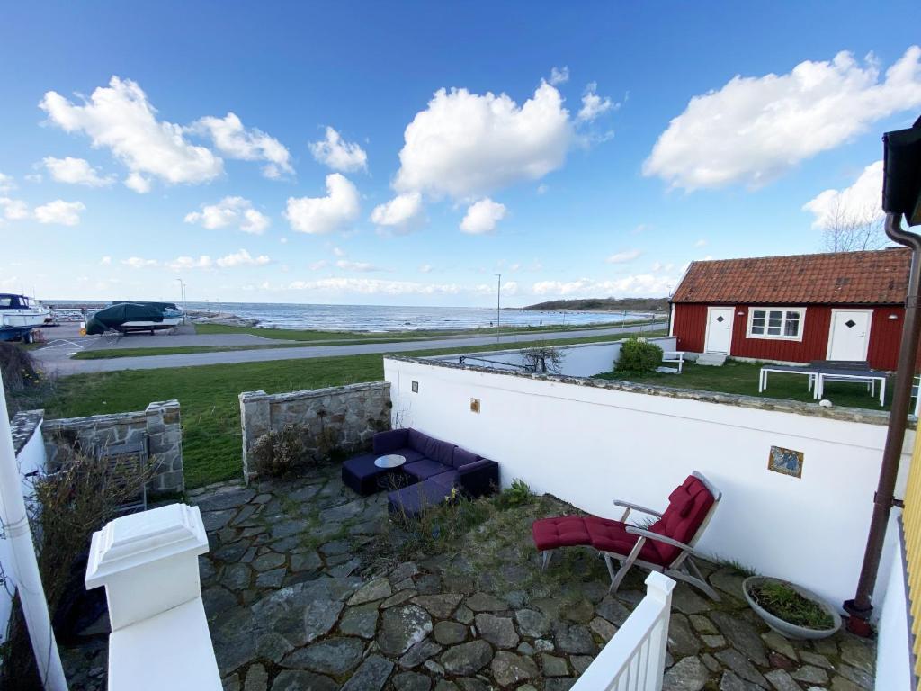 Street house by Torekov harbor with sea view photo 1