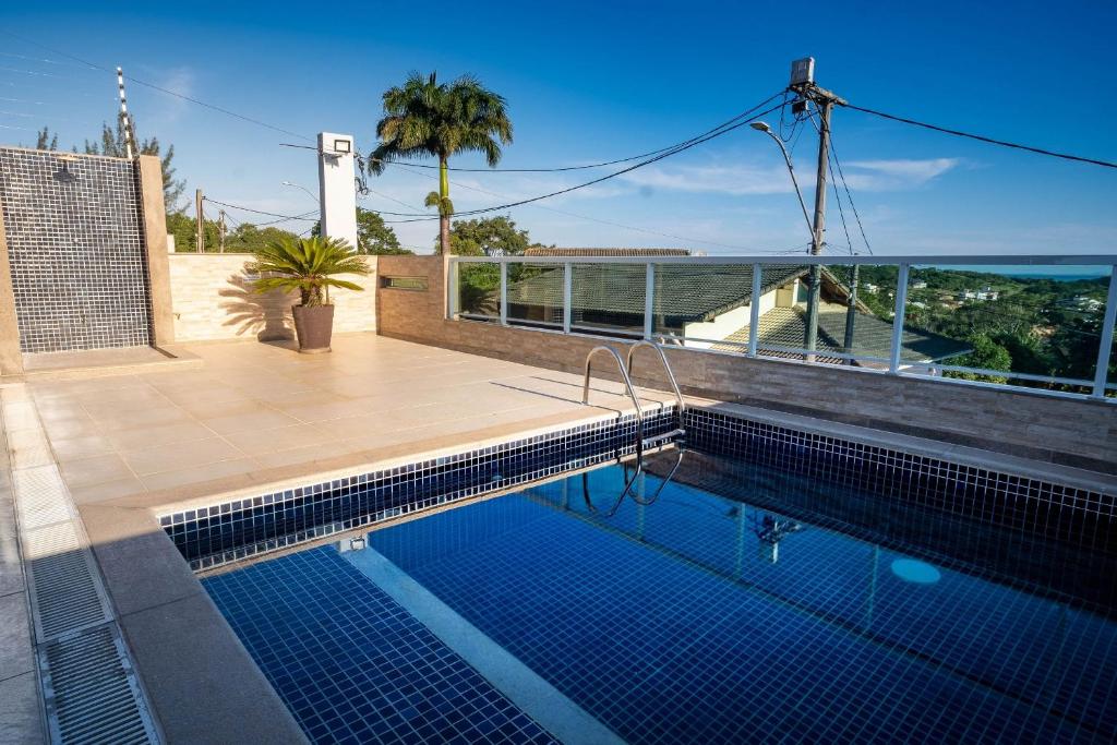 Casa de alto padrão perto da praia de Costazul - WIFI 200MB - Piscina privativa - Netflix - 3 Quartos - Garagem - Cozinha equipada - Churrasqueira - Pet Friendly photo 1