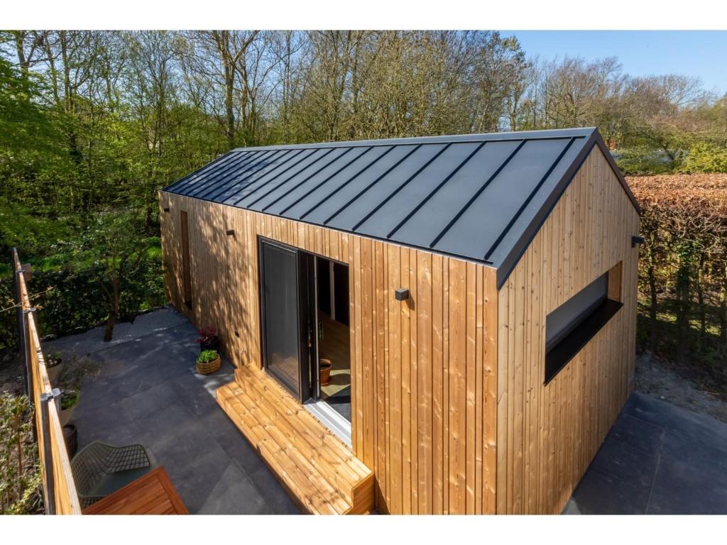 Enjoy a holiday in the cozy Tiny house on the edge of the forest and the dunes! photo 1