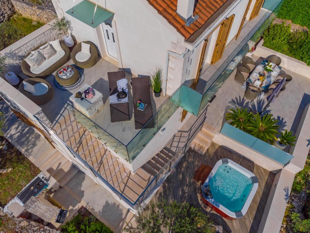 Uniquely designed Villa Ivana with outdoor Jacuzzi nearby the pebble Banje beach at the Island of Solta photo 1