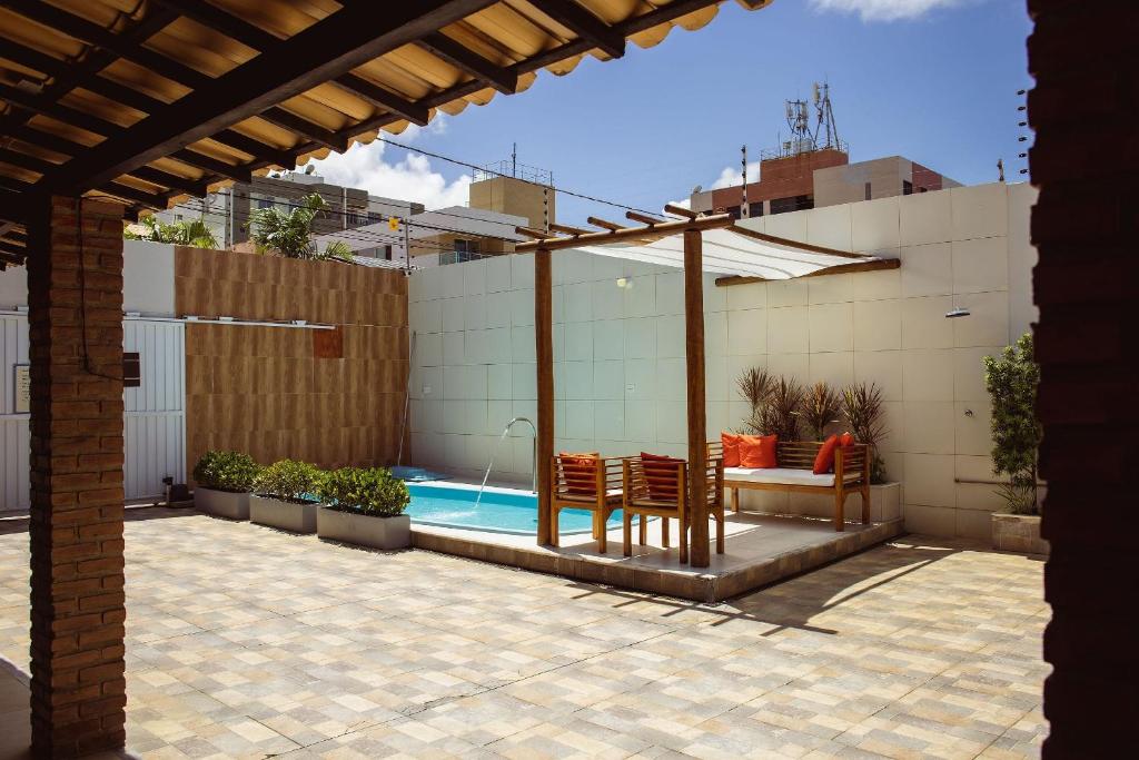 FLAT com 2 QUARTOS a 100m ORLA ATALAIA na TEMPORADA737 com PISCINA, CHURRASQUEIRA - Wi-Fi 180mbps e Cozinha photo 1
