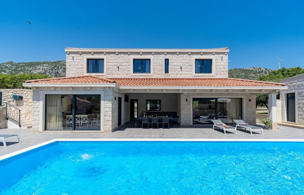 NEW! Stylish Villa Neven with 44sqm heated private pool, 4 en-suite bedrooms, 2 living and dining areas, wine cellar photo 1