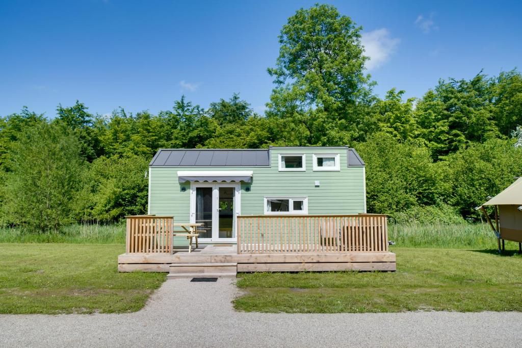 Green Tiny House with shared pool
