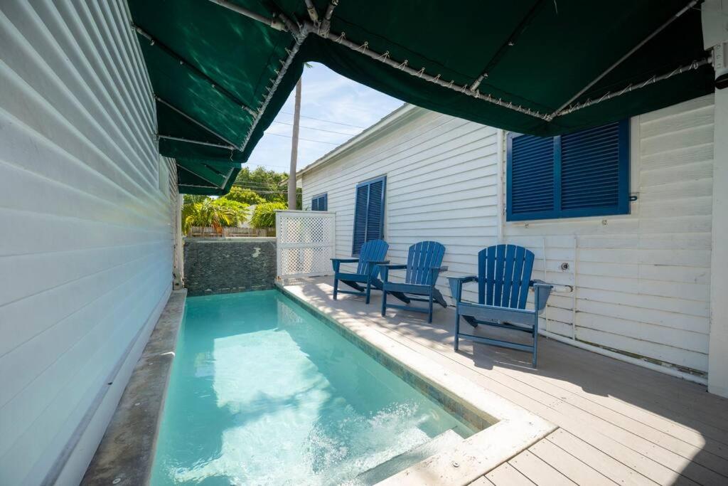 Just steps to Duval- Sleeps 10- Heated Pool House photo 1