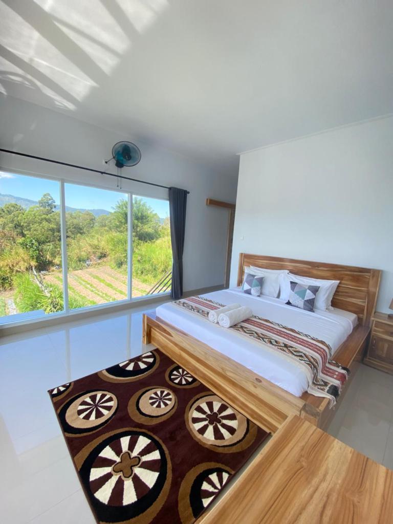 Batur Pyramid Guesthouse - Tap to explore photos