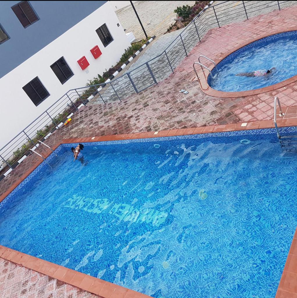 Lovely 4 bedroom house with pool, gym, wifi and 24hrs power photo 1