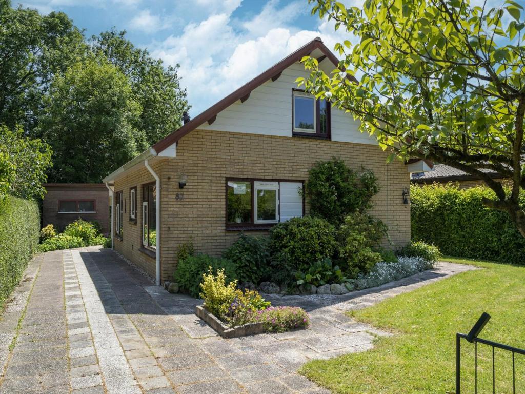 Modern holiday home in Baarland with swimming pool