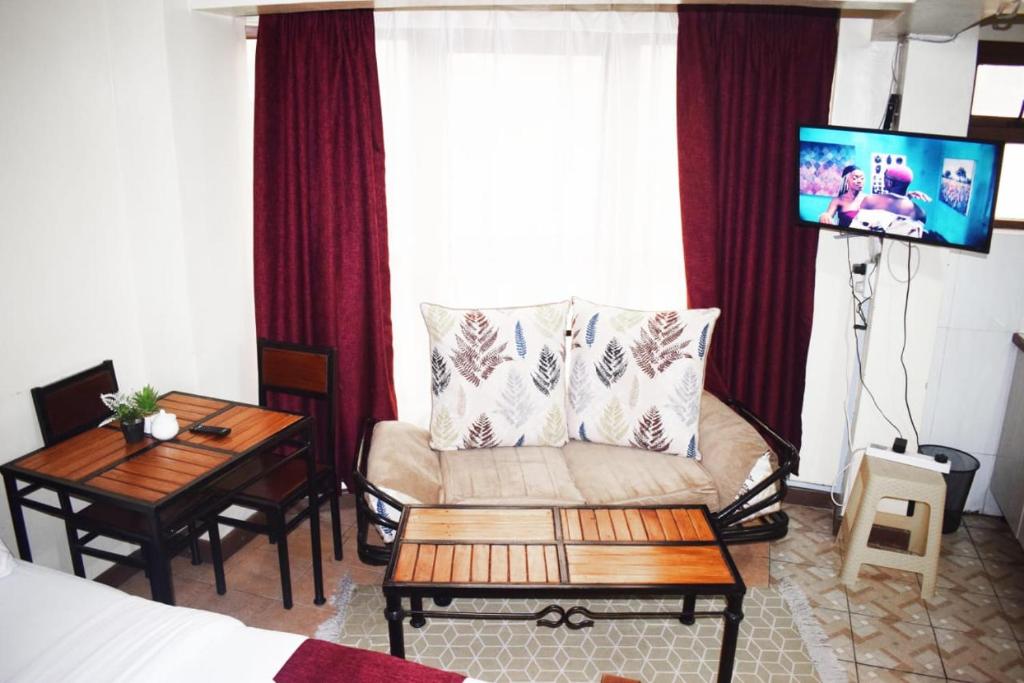 Emeli Suites - Tap to explore photos