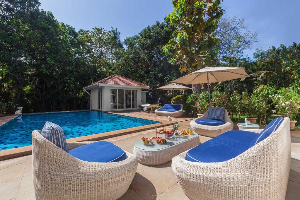 Hamptons Charm by StayVista with Pool, lawn, table tennis & chic interiors photo 1