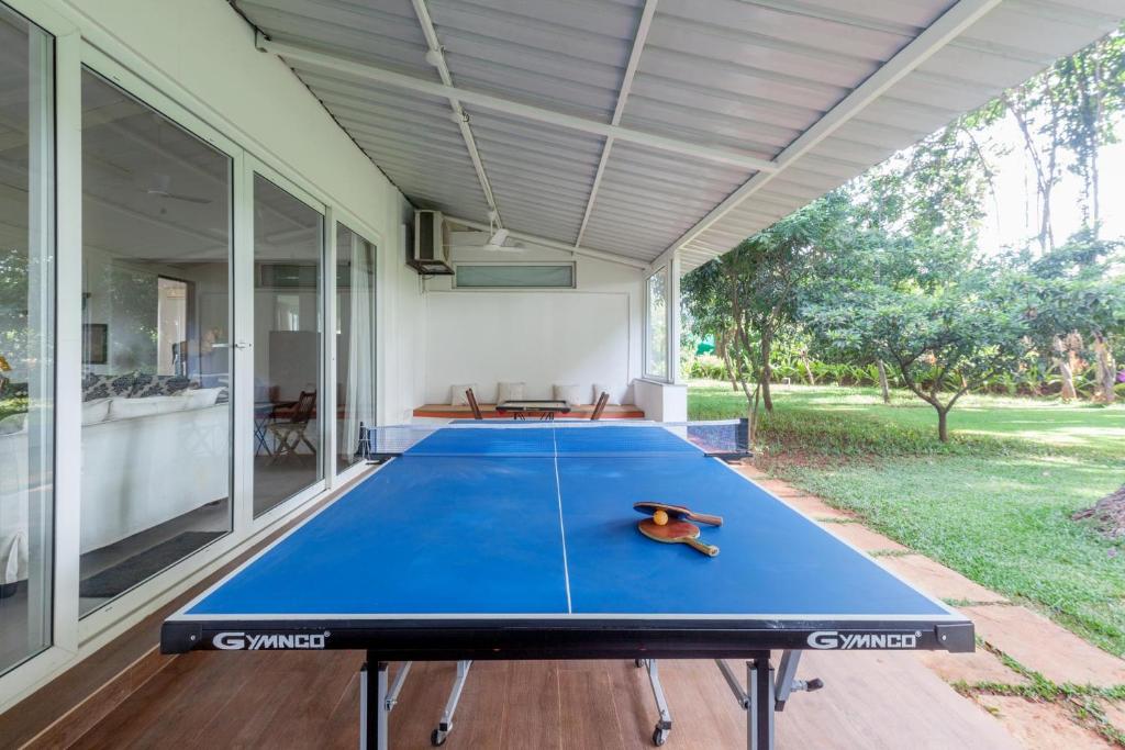 Hamptons Charm by StayVista with Pool, lawn, table tennis & chic interiors photo 3