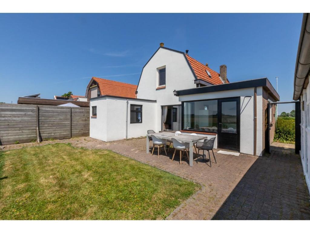 characteristic house in a rural location in the village of Zuidzande with garden photo 4