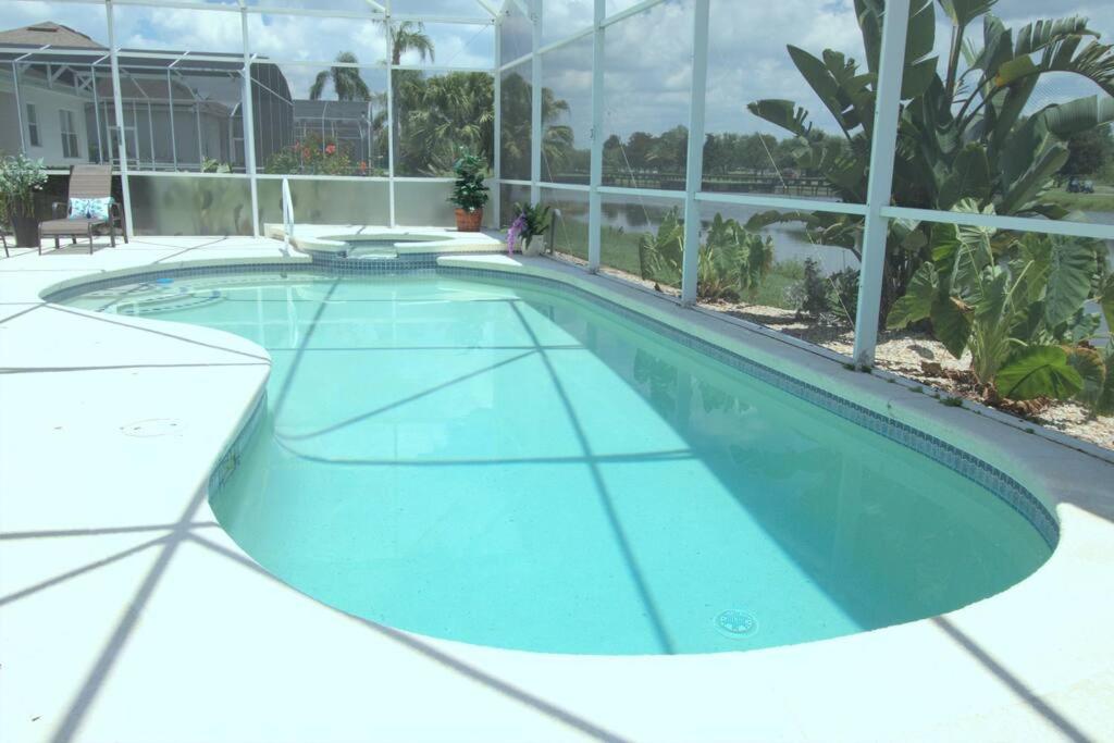 Entire home with pool and lake view and Golf course by Disney photo 3