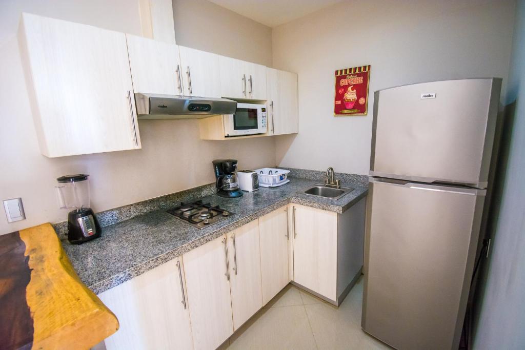 Playa Centro Rooftop Apartments & Studios - Tap to explore photos
