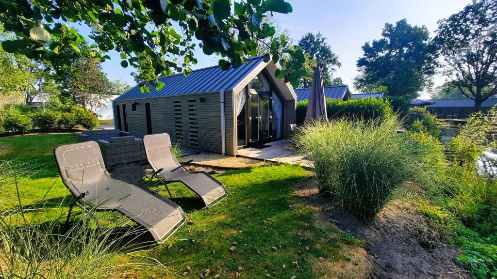 Ferienhaus Holland Beachhouse, modern eingerichtet, in schöner Lage am Veluwemeer, inklusive Garten, Terrasse am Wasser, Parkplatz und WLAN
