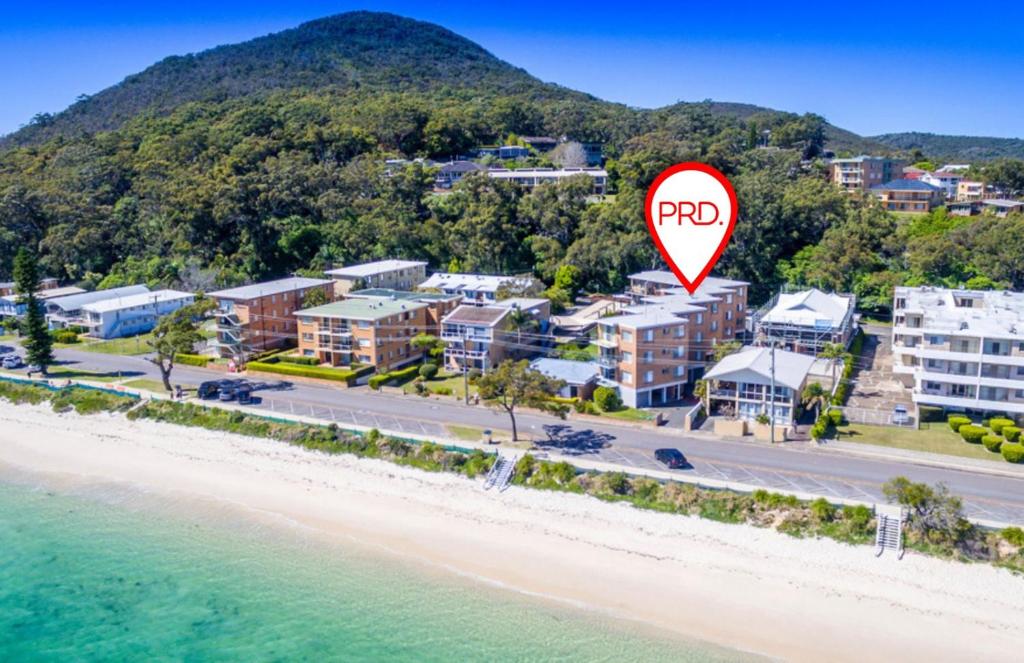 Sparkling water views over Shoal Bay beach photo 1