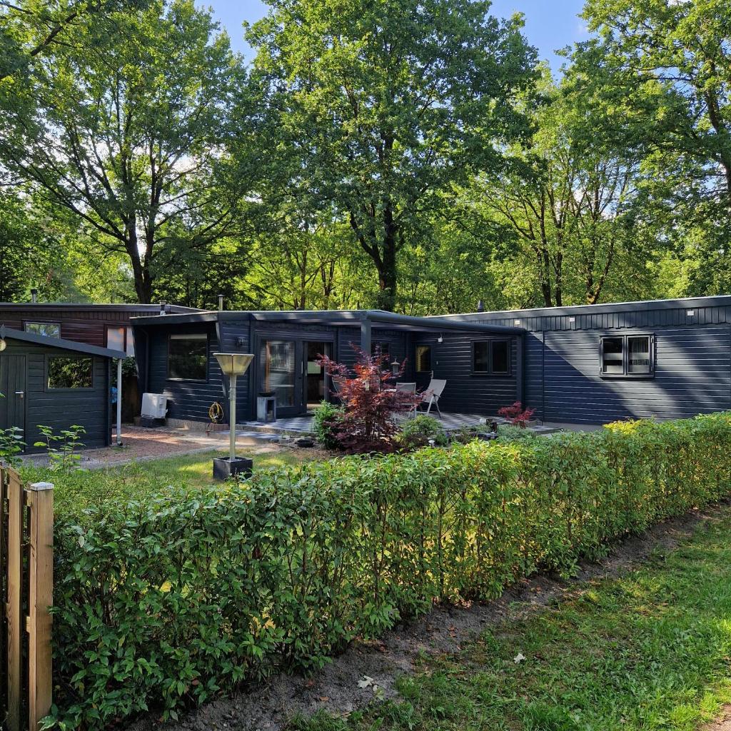 Riant huisje in bosrijke omgeving op chaletpark Kempenbos