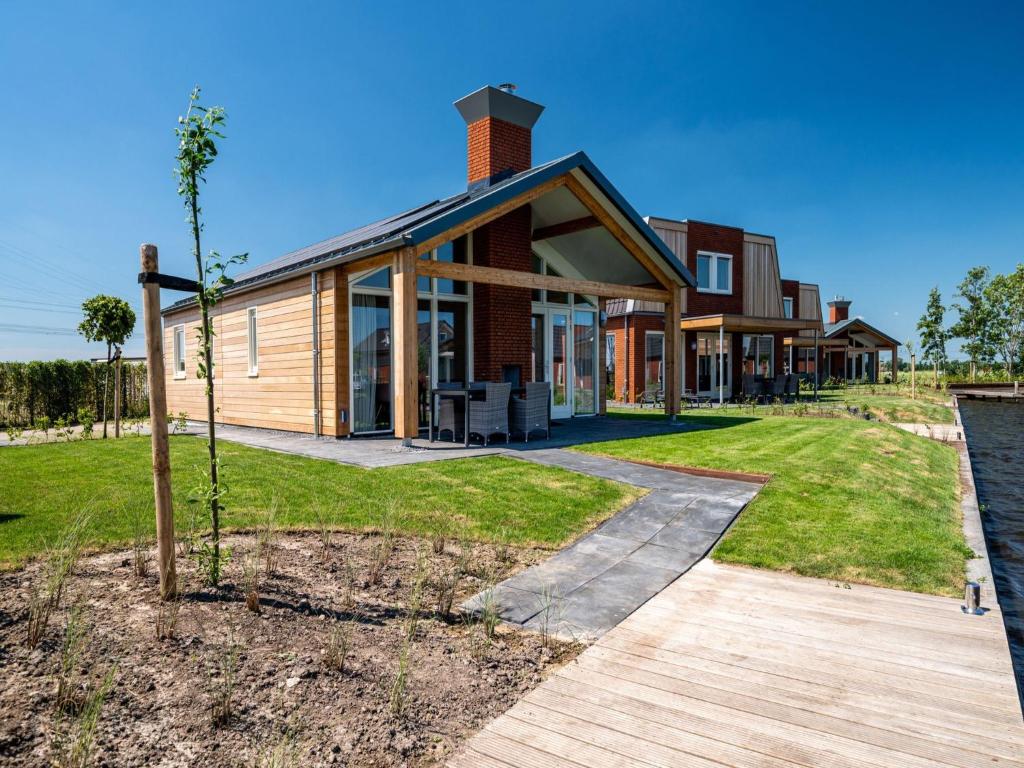 Disabled house on the water, on a holiday park in Friesland photo 2