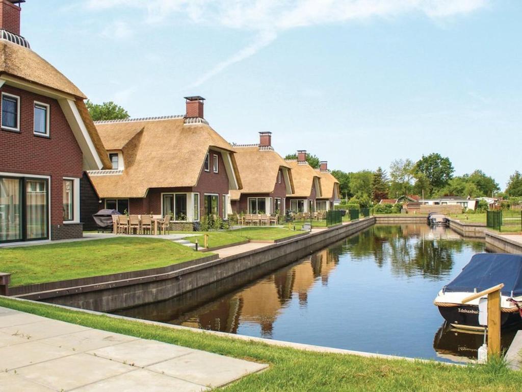 Atmospheric villa on the water, at a holiday park in Friesland photo 1