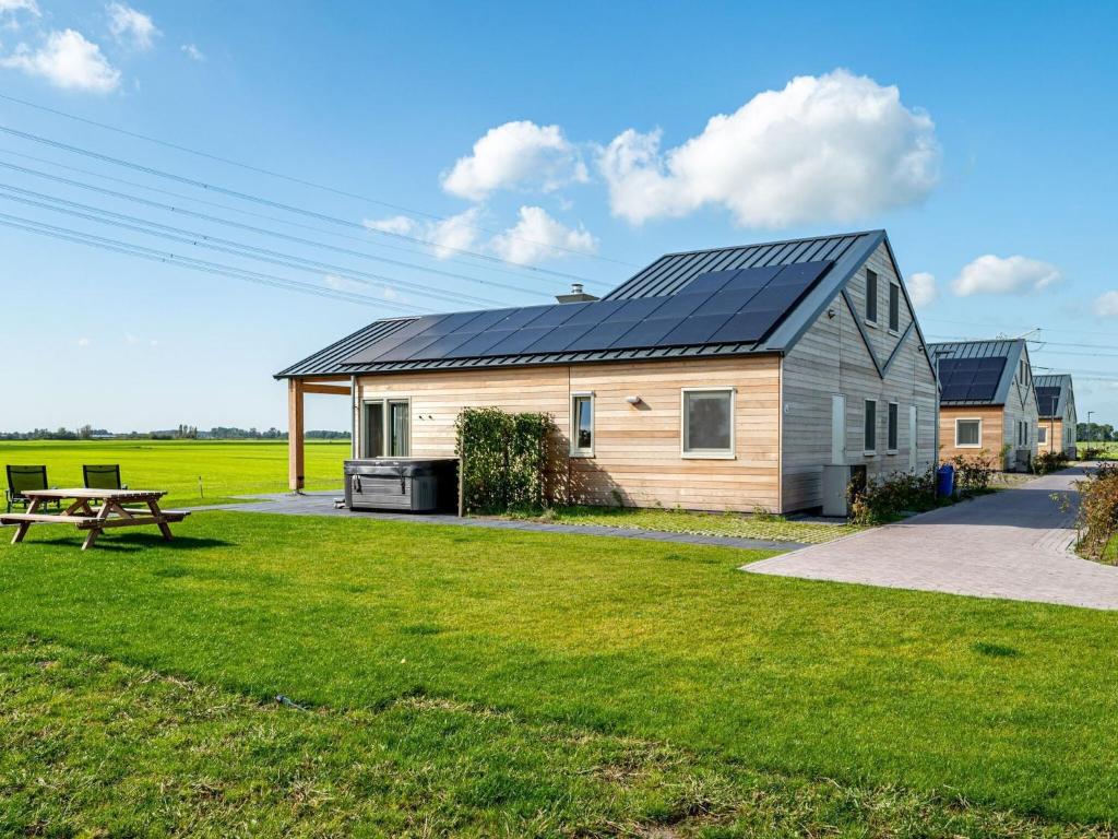Wellness home located on the water, on a holiday park in Friesland photo 1