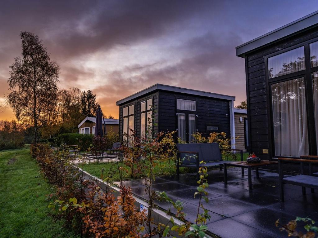 Nice chalet on the water with wood-fired hot tub, in a holiday park photo 1