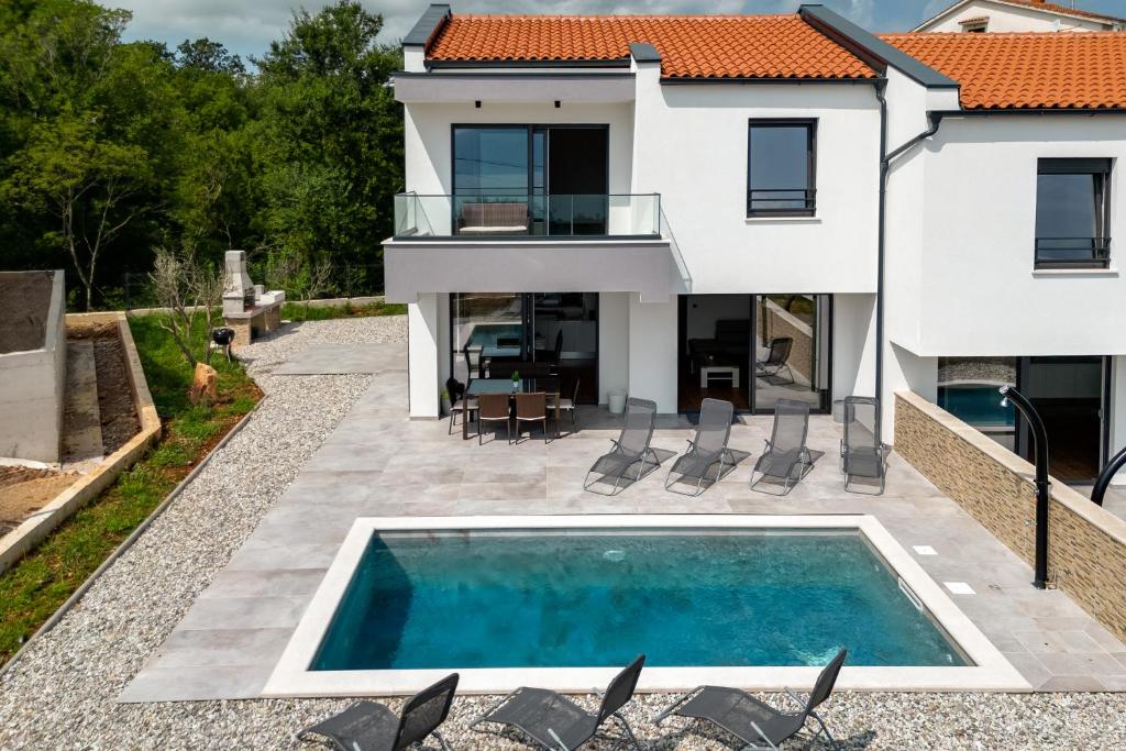 Villa Lavanda -semi-detached villa with a pool and a panoramic view, close to a sandy beach- by TRAVELER tourist agency Krk