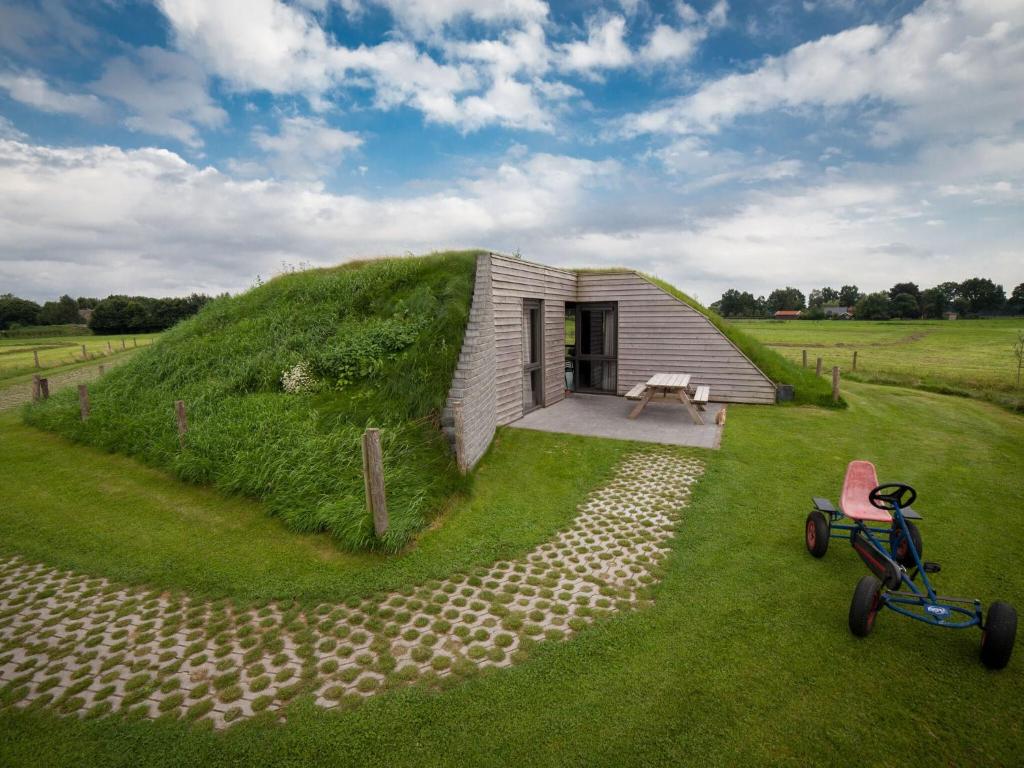 Ecological bungalow with decorative fireplace, located on a holiday farm