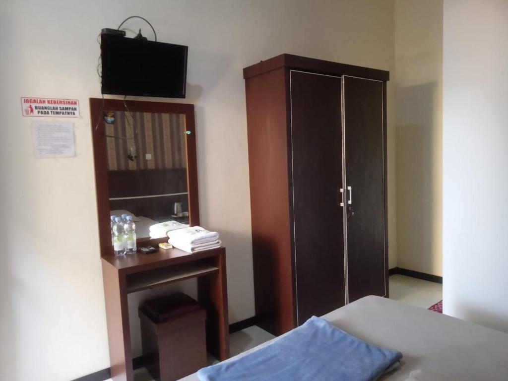 Riki Guesthouse Syari'ah - Tap to explore photos