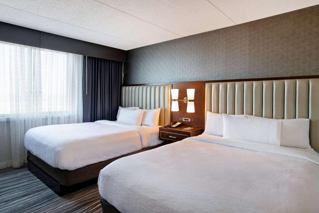 Embassy Suites Syracuse - Tap to explore photos