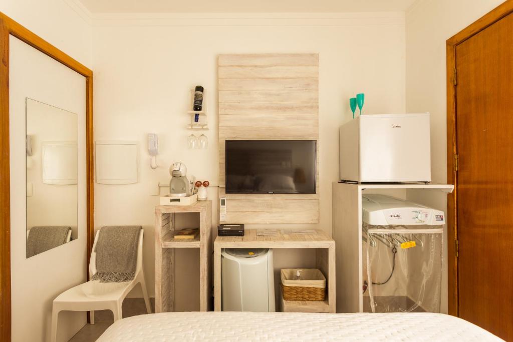Petite Suite Juquehy - A 2 quadras do Mar - Pequena mas completa - Ar condicionado - Frigobar -TV smart tela plana - Serviço de Praia - Roupa de cama e banho luxo - Zero mofo - Wi Fi - Tudo novo ! photo 3