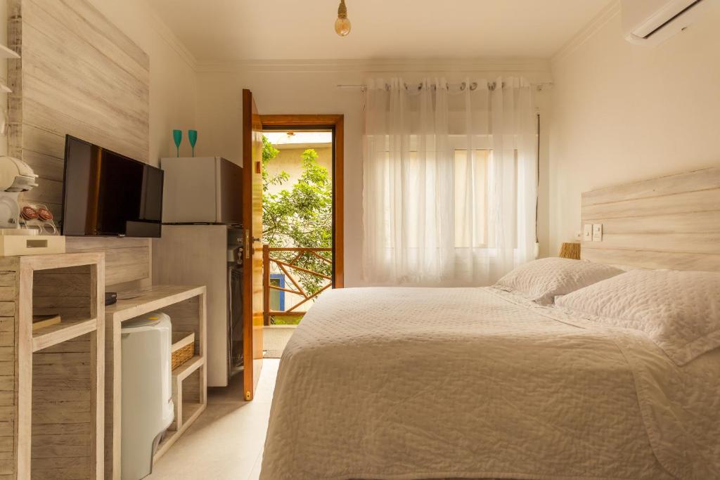 Petite Suite Juquehy - A 2 quadras do Mar - Pequena mas completa - Ar condicionado - Frigobar -TV smart tela plana - Serviço de Praia - Roupa de cama e banho luxo - Zero mofo - Wi Fi - Tudo novo ! photo 2