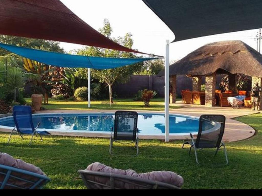 Room in Villa - Zambezi Family Lodge - Rhino Room photo 1