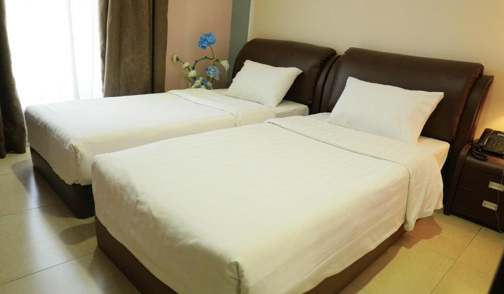Laguna Hotel Suites - Tap to explore photos