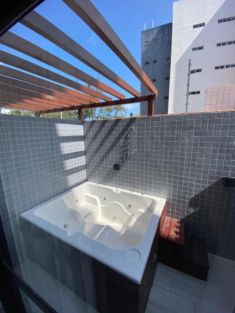 Flat completo - Até 2 Pessoas - Unidade com Jacuzzi privativa e área comum com visão para o mar photo 4