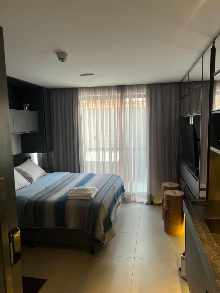Flat completo - Até 2 Pessoas - Unidade com Jacuzzi privativa e área comum com visão para o mar photo 1