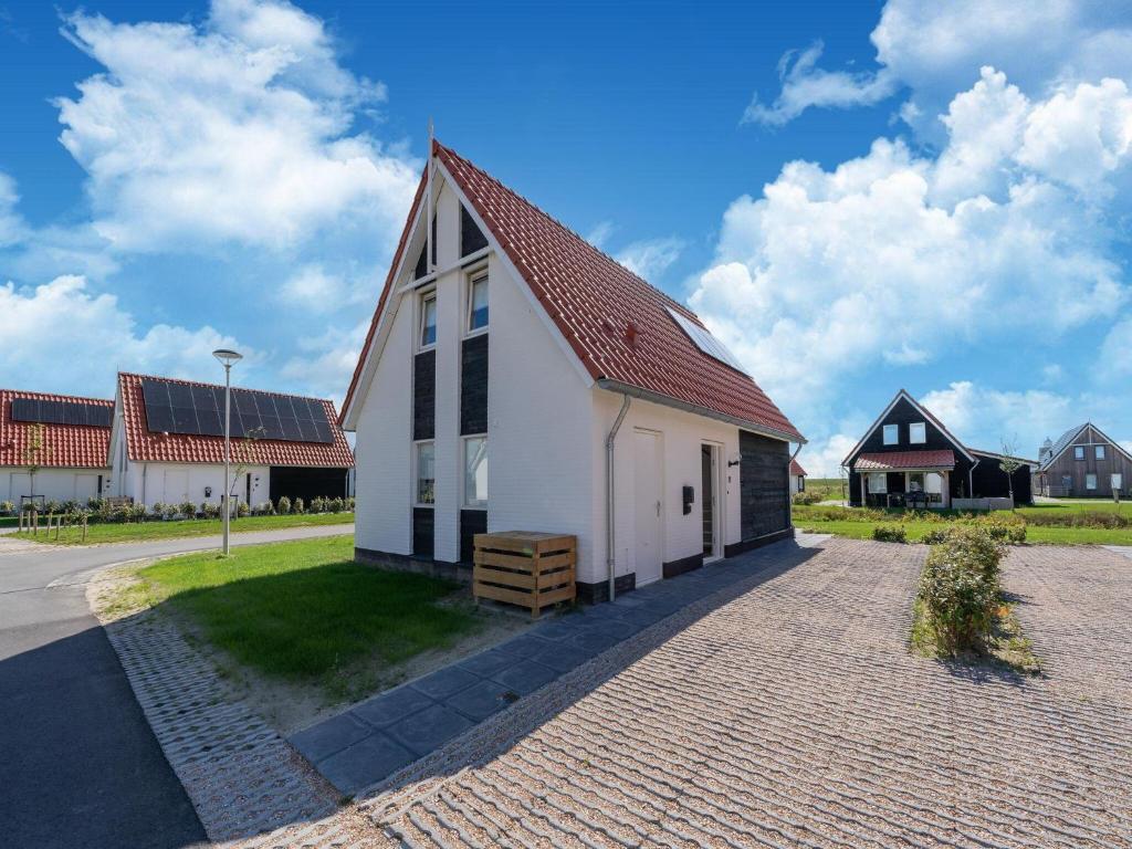 Attractive holiday home in Scherpenisse with roofed terrace