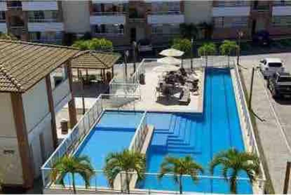 Lindo Apartamento em condomínio 2 quartos com suite e piscina incrivel com raia olimpica ao lado da praia guarajuba - BA
