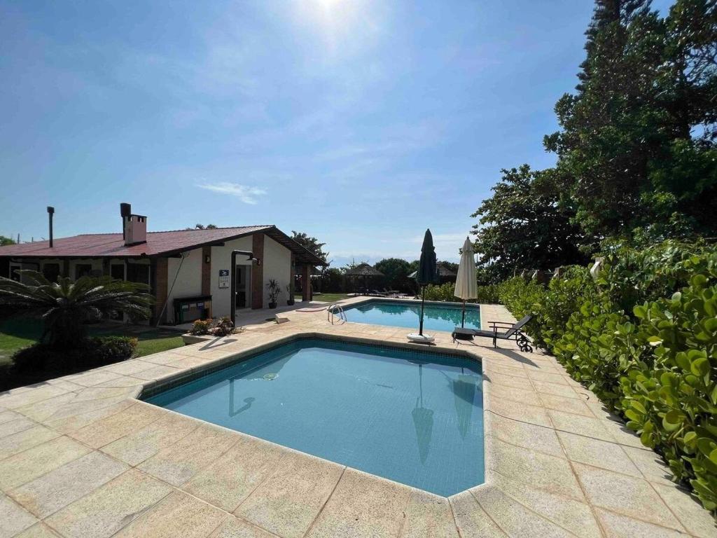Casa pé na areia em praia paradisíaca photo 2