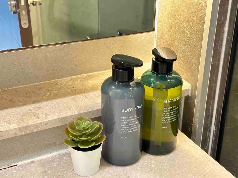 The Astra condo Deluxe Room - Tap to explore photos