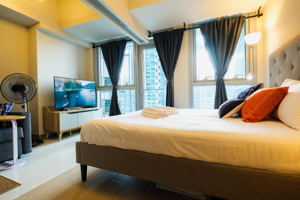 Cozy 1BR Apartment in Manila, BGC, with Balcony & Pool photo 1