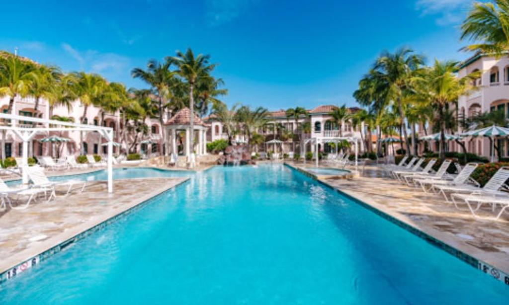 Caribbean Palm Village Resort - Tap to explore photos