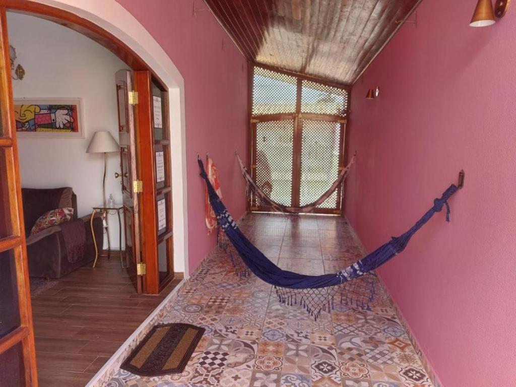Casa Rosa de Peruíbe - Casa de Temporada 3 dormitórios, 10 hóspedes, piscina, wi-fi, netflix, 800 metros da praia photo 3