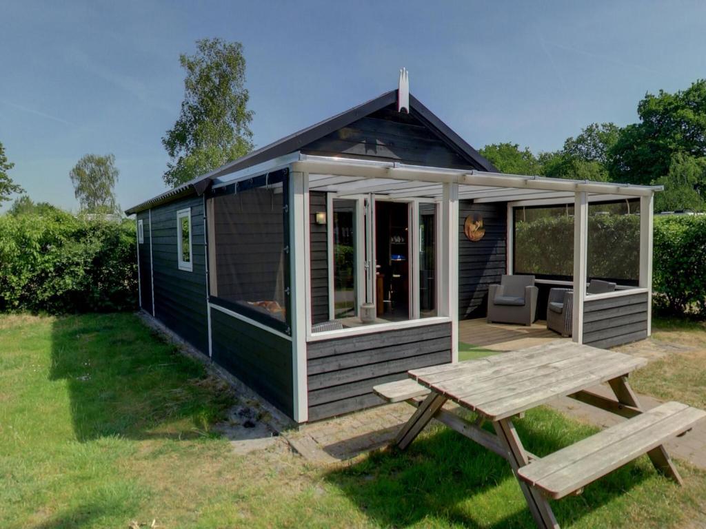 Cozy tentlodge with roofed terrace in a green area